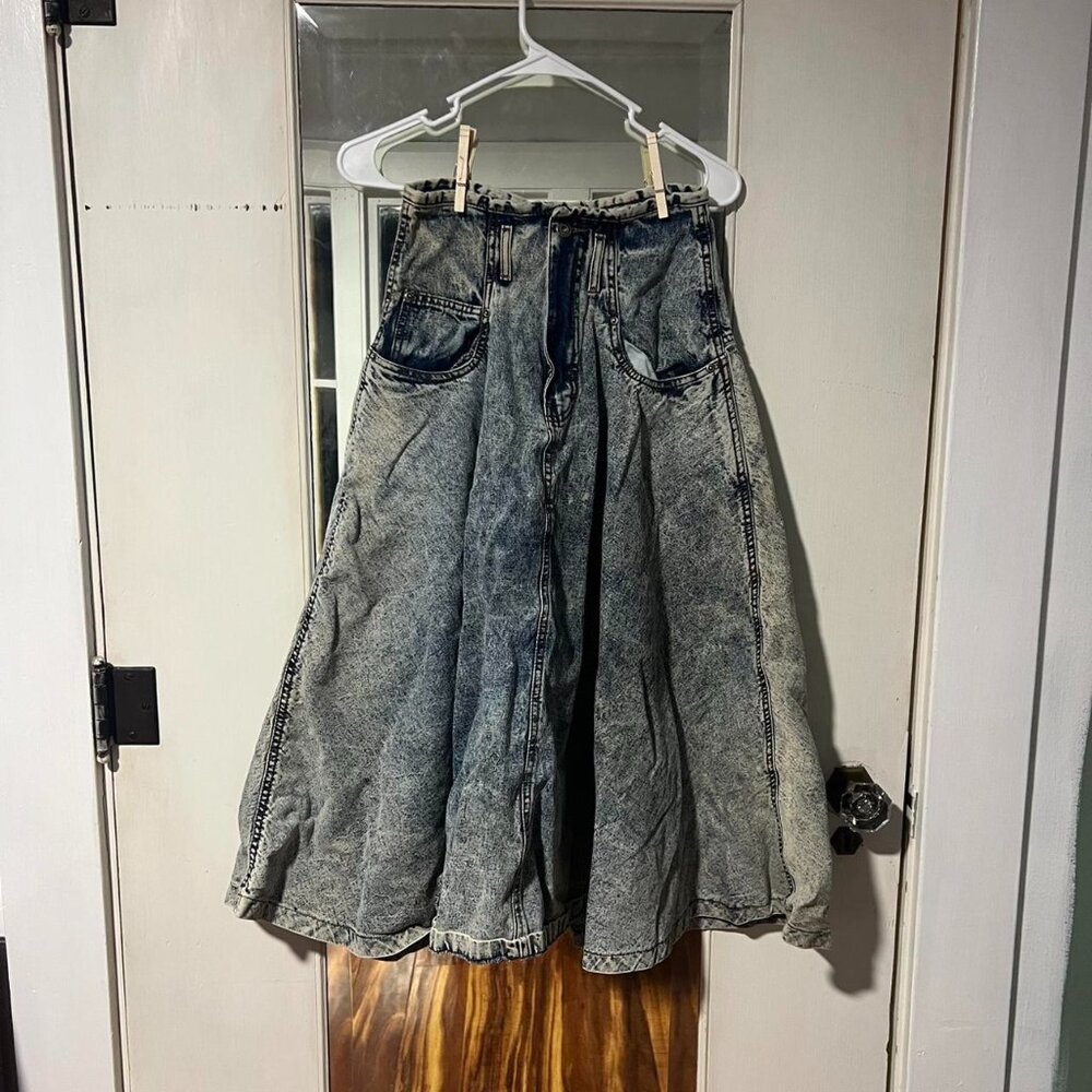 Blue denim skirt with a unique, distressed look #distresseddenim